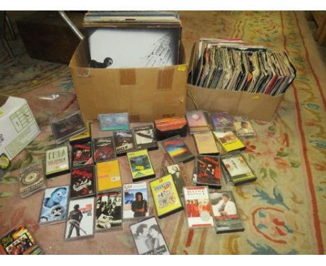 A collection of assorted LP records and 7" singles ranging from 1950s- 2000s together with a selection of vintage cassette ta