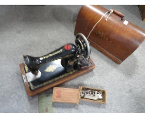 A vintage cased Singer sewing machine 