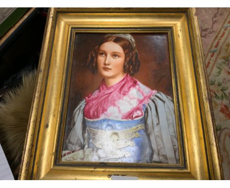 A Continental porcelain plaque depicting a young lady wearing a pink scarf 