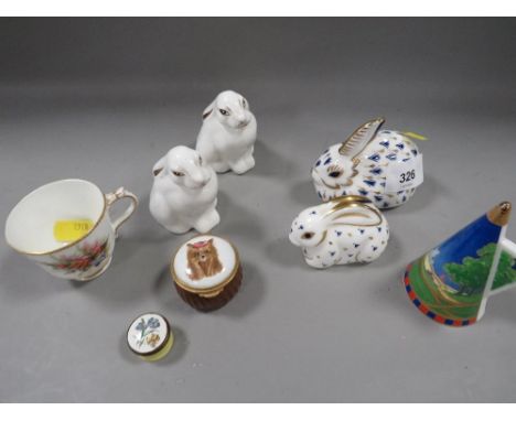 A selection of ceramics to include Royal Crown Derby paperweights, Royal Worcester miniature cup etc 
