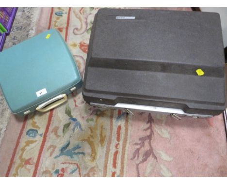 A vintage Smith Corona portable typewriter together with a smaller example 