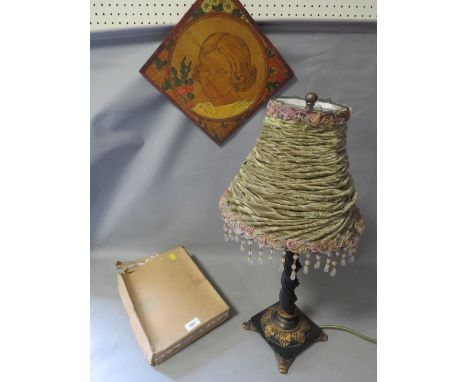 A vintage lamp together with a vintage bolero 