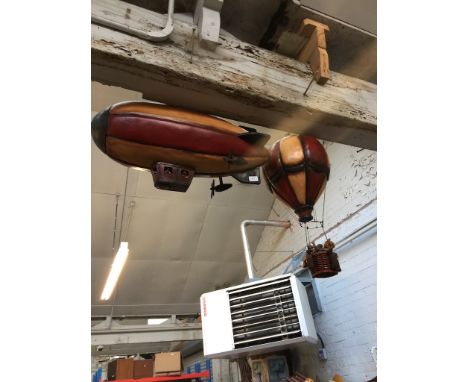 A MODEL BLIMP AND HOT AIR BALLOON
