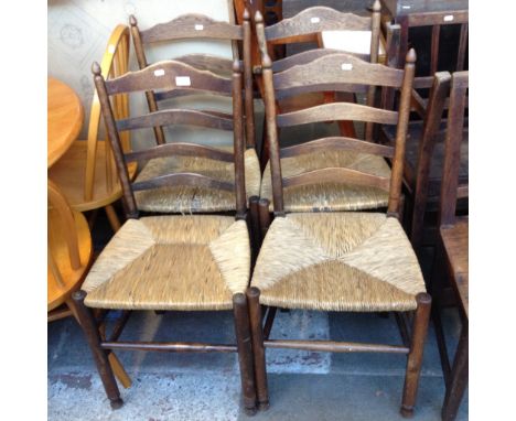 A SET OF FOUR RUSH SEATED LADDER BACK CHAIRS