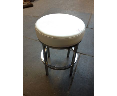 A MODERN CREAM AND METAL STOOL