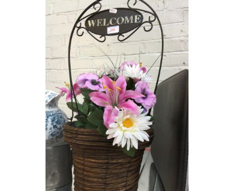 A PLANTER WITH ARTIFICIAL PLANTS