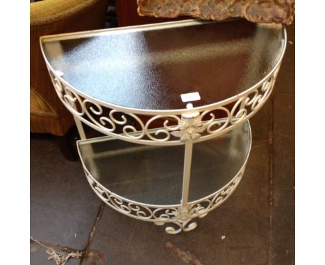 A GLASS AND METAL CONSOLE TABLE