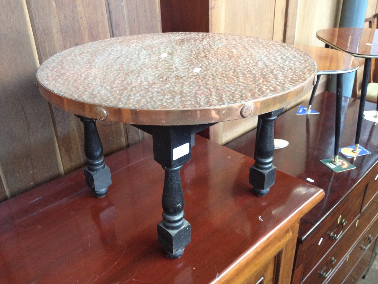 A HAMMERED COPPER TOP TABLE