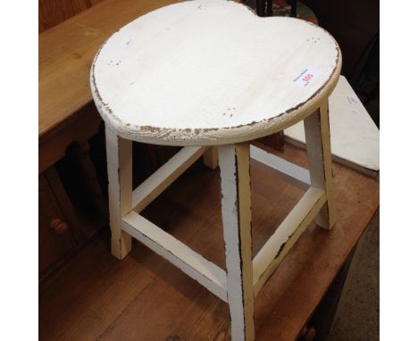 A HEART SHAPED STOOL