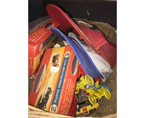A BASKET OF MODEL VEHICLES