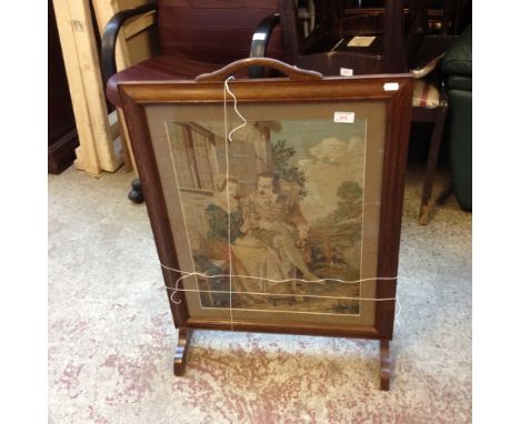 A NEEDLEWORK AND OAK FRAMED FIRE SCREEN