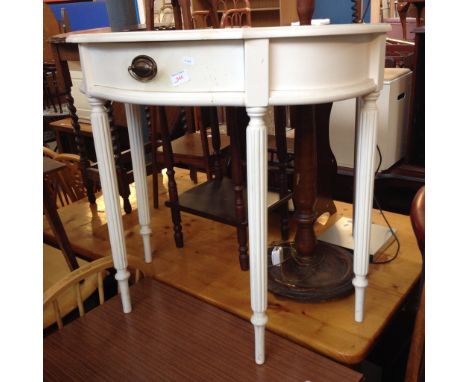 A WHITE CONSOLE TABLE WITH DRAWER