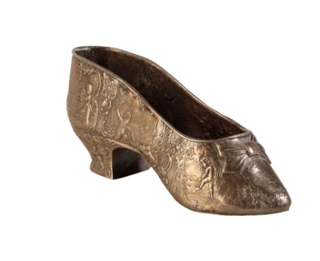 19TH CENTURY CONTINENTAL SILVER MODEL OF A SHOE, embossed figural and foliate decoration, 17cm long (c.3.2oz)