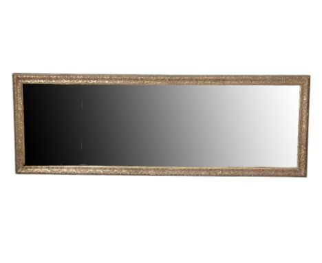 LOUIS XIV CARVED AND GILTWOOD FRAMED OVERMANTEL MIRROR, second half 17th century, the three bevelled glass plates within an o