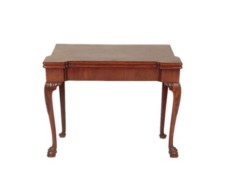 GEORGE II MAHOGANY CARD TABLE, the folding eared rectangular top with a baize-lined interior and candlestands in the corners,