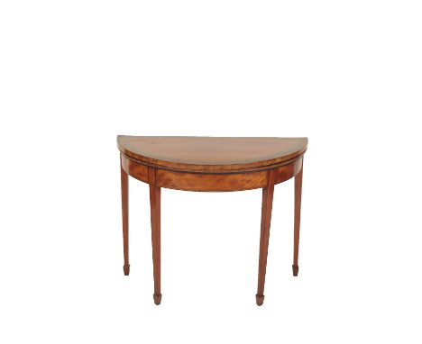 GEORGE III STYLE SATINWOOD AND PART PAINTED DEMI-LUNE CARD TABLE IN SHERATON TASTE, the hinged top decorated with a border of