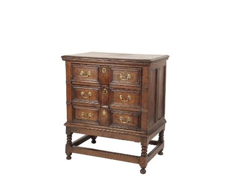 JACOBEAN OAK CHEST ON STAND, ELEMENTS 17TH CENTURY AND LATER, the top with ovolo moulded edges, above three drawers, each wit