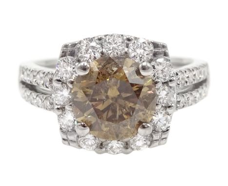 18ct white gold round brilliant cut fancy light brown diamond ring, with halo diamond surround and diamond set shoulders, sta