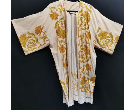 Antique cotton short robe with crewelwork embroidery, some light staining 