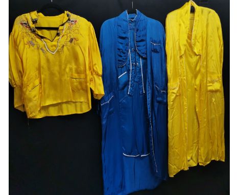 Three Chinese garments, 1950s yellow embroidered blouse small stain to front, dressing gown and blue pyjama set t/w yellow ro