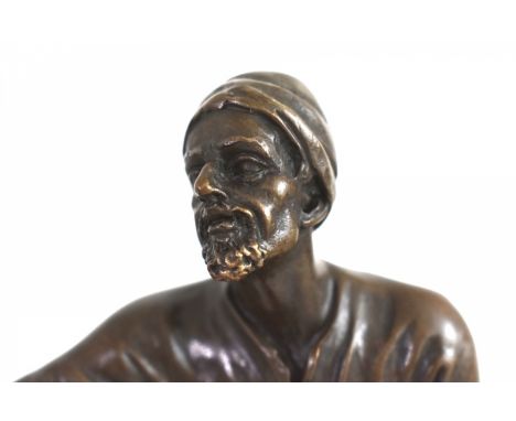 A solid bronze sculpture of a tapestry vendor, in art deco style. It is singned by Bergman at the bottom.The sculpture is in 