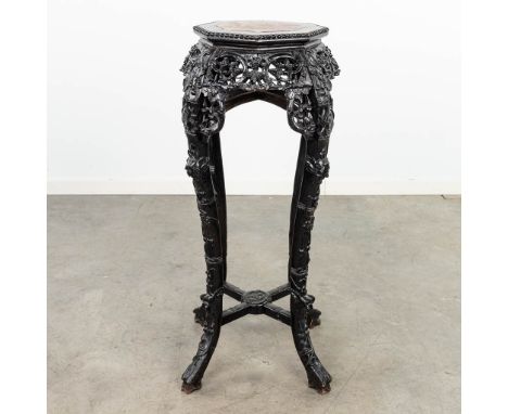 An Oriental high planter, made of hardwood and finished with marble. Dimensions: (L: 52 x W: 52 x H: 91 cm)