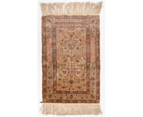 An Oriental hand-made carpet, silk. Hereke.Dimensions: (L: 60 x W: 92 cm)