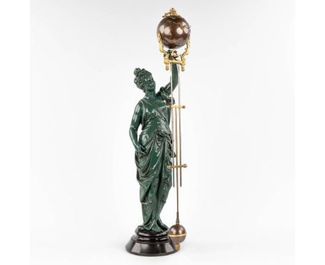 A mysterious table clock with a large green-patinated spelter figurine. 20th century. Dimensions: (H: 71 cm)