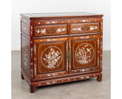 An Oriental commode decorated with mother of pearl. The second half of the 2th century. Dimensions: (L: 50 x W: 92 x H: 84 cm