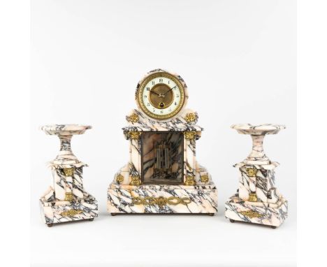 A three-piece garniture clock and side pieces, made of white and gray marble. Circa 1900. Mercury pendulum and half-hour stri