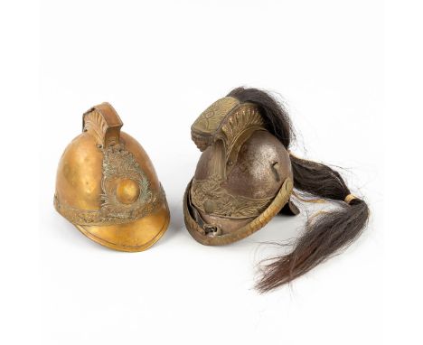 Alexis Godillot, an antique French cuirassier helmet, added a French Firefighter's helmet. Dimensions: (L: 27 x W: 26 x H: 20