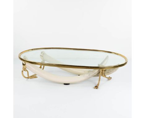 Valenti ' COLMILLOS', a coffee table with elephant tusks and glass in Hollywood Regency style. Tusks made of resine and brass