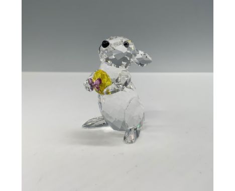 This delightful Swarovski crystal rabbit figurine, designed by Heinz Tabertshofer, features exquisite craftsmanship. The rabb