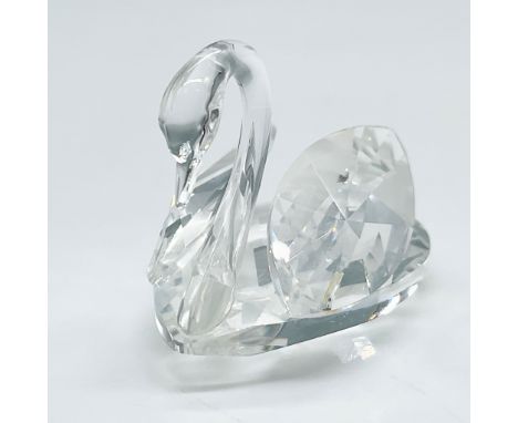 Swarovski Silver Crystal medium swan figurine, featuring precision-cut clear crystal facets that beautifully capture and refl