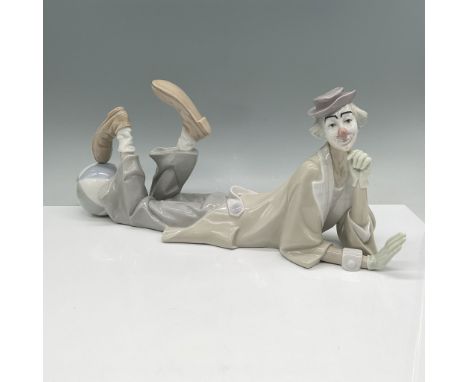 Charming Lladro porcelain figurine titled Reclining Clown, model number 01004618. This playful piece features a whimsical clo