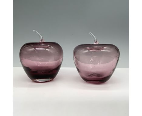 This lot features two purple glass apple figurines with clear glass stems. The rich purple tones in each apple create an eleg