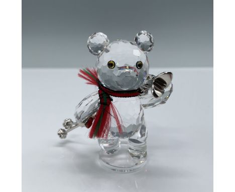 Swarovski crystal figurine titled "Kris Bear with Skis," featuring a charming bear holding skis and ski poles, accented with 