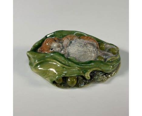 A charming Beswick Beatrix Potter figurine featuring Timmy Willie Sleeping, a beloved character from Beatrix Potter's "The Ta