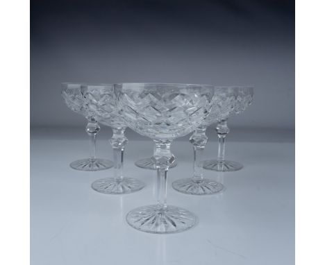 This exquisite set of six Waterford crystal champagne coupes features the elegant Powerscourt pattern, renowned for its intri