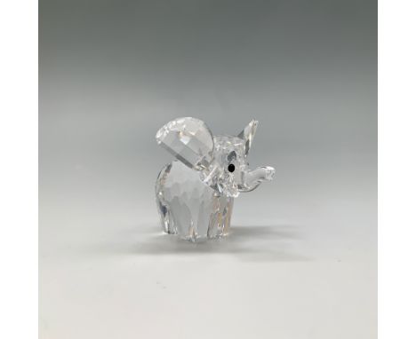A Swarovski crystal small elephant figurine, item number 151489, designed by Adi Stocker. Introduced in 1989 and retired in 2
