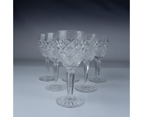 This set of six Waterford Crystal Claret Wine Glasses showcases the elegant Comeragh pattern, renowned for its intricate diam