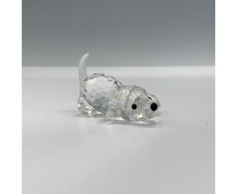 This retired Swarovski crystal figurine, "Beagle Puppy Playing," was part of the Peaceful Countryside theme group. The facete