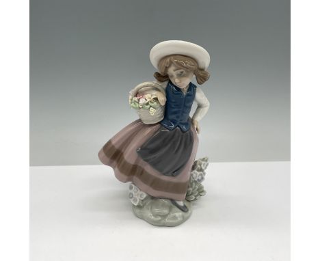 Lladro porcelain figurine titled Sweet Scent, model number 01005221, designed by Jose Puche. This charming piece features a y