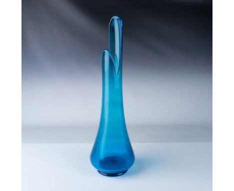 Beautiful mid-century modern Tundra vase in vibrant blue glass. This elegant vase showcases a tall, curved silhouette with a 