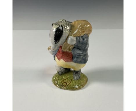 Charming ceramic figurine of Tommy Brock, the badger from Beatrix Potter's beloved tales. This finely detailed piece captures