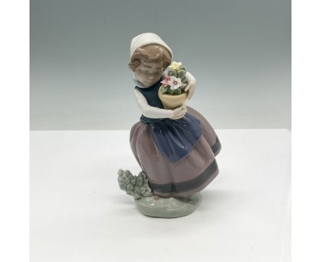 Lladro porcelain figurine titled Spring is Here, model number 01005223. Designed by Jose Puche, this exquisite piece depicts 