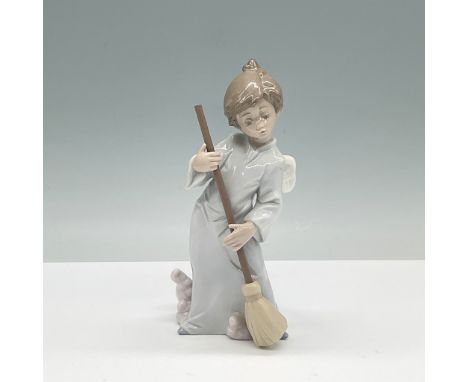 Lladro porcelain figurine titled Sweep Away the Clouds, model number 01005726. This charming piece features a young angel wit
