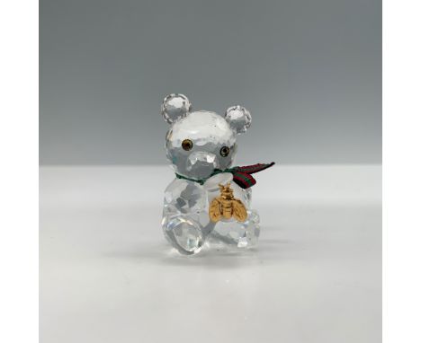 This enchanting Swarovski Kris Bear figurine, titled "Honey Pot," was designed by Martin Zendron. Introduced in 1997 and reti