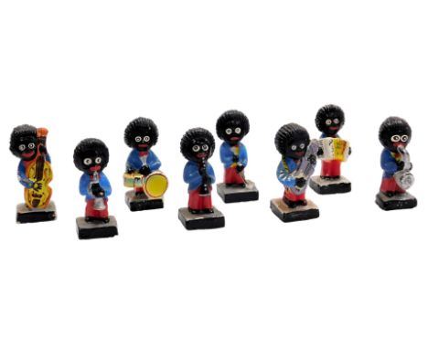 A Robertson's eight piece band group, 7.5cm high. Notice from the the-saleroom.com: These items are listed on the basis they 
