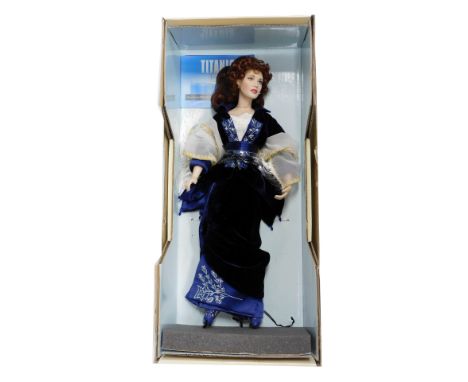 A Franklin Mint Titanic Porcelain Rose Flying doll, with certificate, boxed.